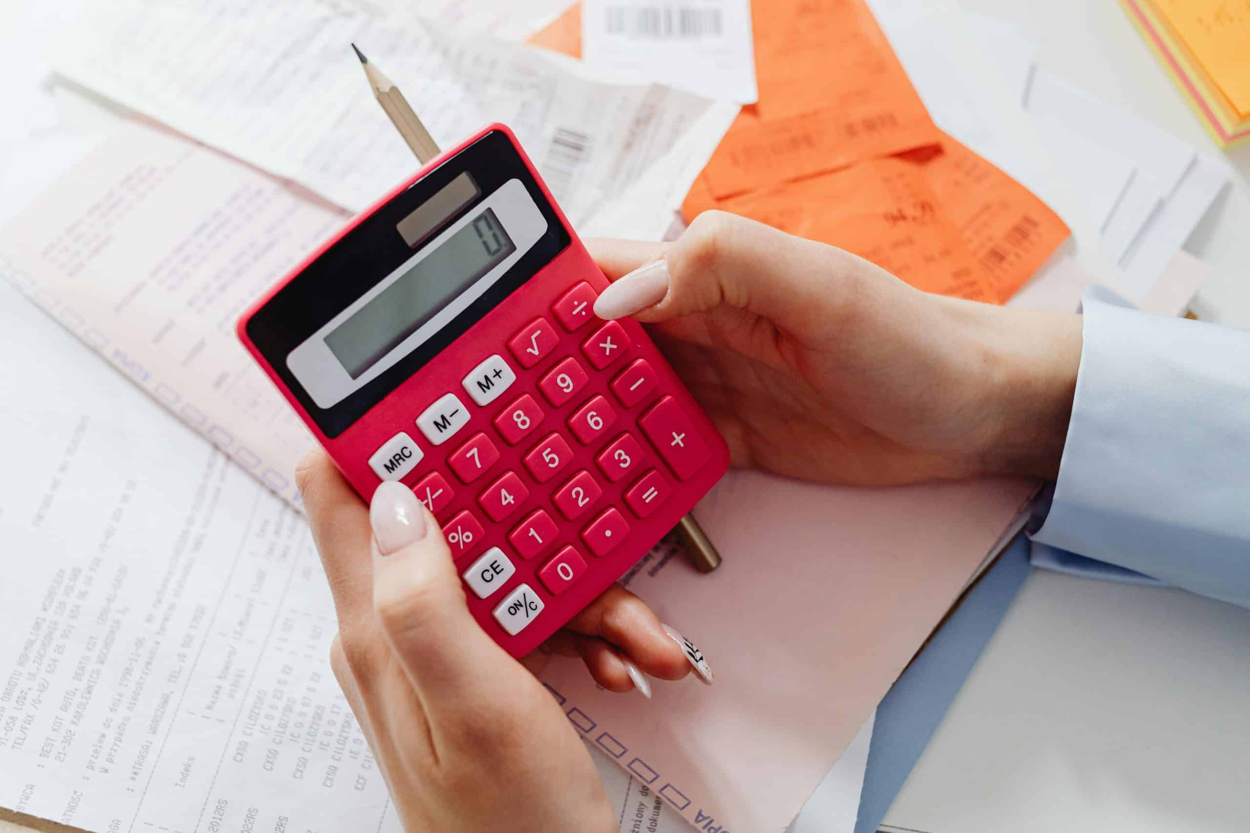 UK Consumer Finance Weekly Round Up. Person checks finances